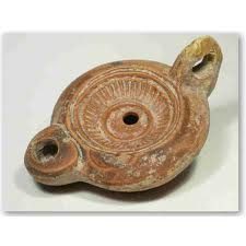 Decorated ancient oil lamp